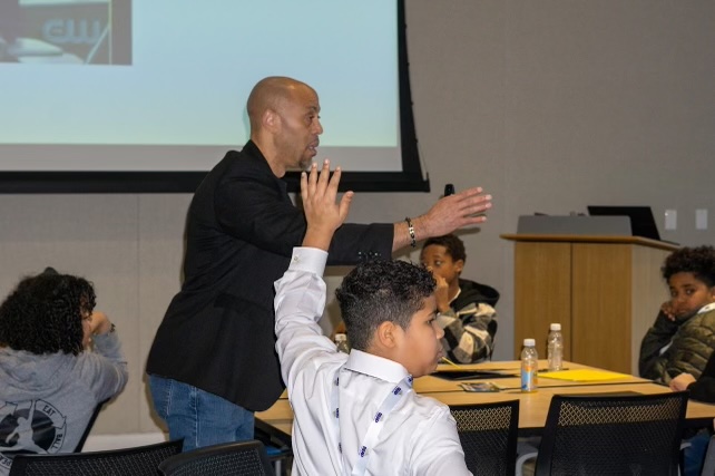 Dr. Dempsey speaking with REAP youth